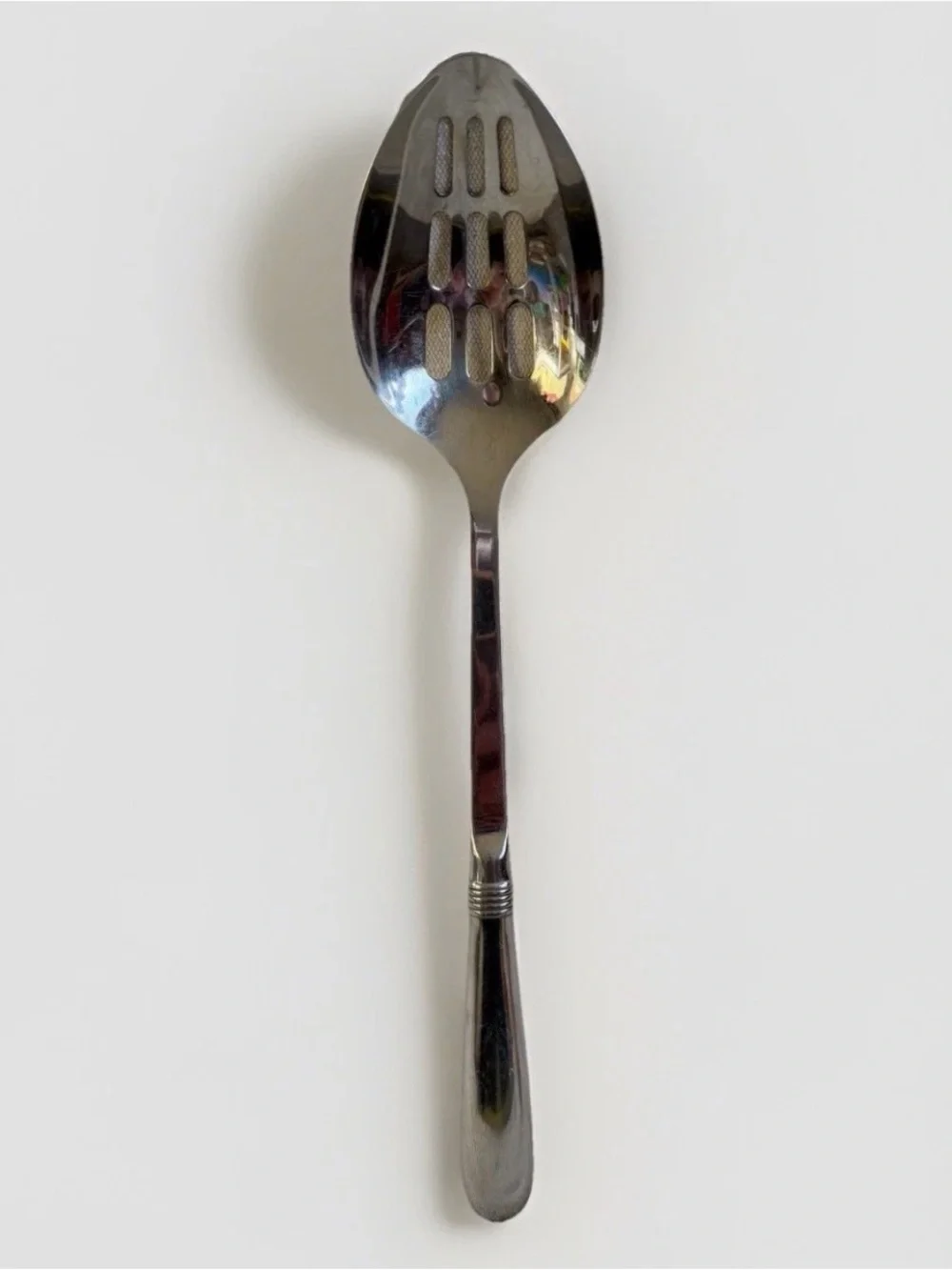 Oneida Mercutio Slotted Serving Spoon 18/8 Stainless Glossy Flared Tip
